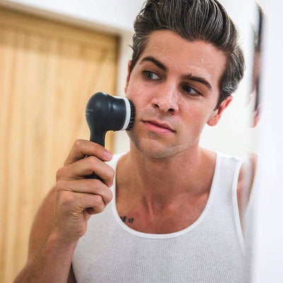 Male model using the Clarisonic Mia Men Sonic Facial Cleansing Device With Charcoal Brush Head on their face